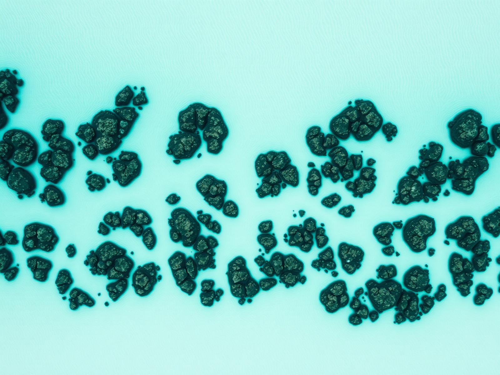 Aerial reef pattern in shallow turquoise water.
